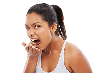 Image showing Portrait, diet and woman with chocolate, eating and wellness isolated on a white studio background. Face, person and model with candy, hungry and unhealthy snack with mockup space, nutrition and food