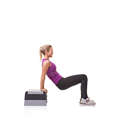 Image showing Woman, aerobics step and exercise in studio profile with smile, training or health by white background. Girl, person and mockup space for workout, fitness or wellness on floor with balance for muscle