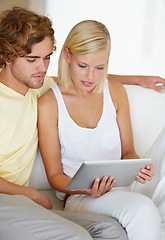 Image showing Reading, tablet and young couple on sofa browsing on social media or internet at apartment. Relax, digital technology and happy man and woman from Australia scroll on website in living room at home.