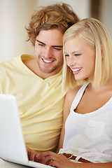 Image showing Happy couple, watch on laptop and relax together for home streaming service, website and movie choice on weekend. Young man and woman reading information on computer or technology for online search