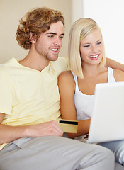 Image showing Credit card, laptop and couple in a house for ecommerce, payment or investment growth check. Love, online shopping and people in a living room with budget, savings or internet search for sale or deal