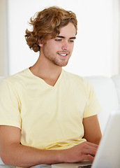 Image showing Laptop, search and happy man on sofa for remote work research, planning or web communication at home. Tech, freelance or male entrepreneur online in living room with social media, chat or streaming