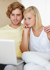 Image showing Laptop, love and couple relax in a house streaming movies, video or film, show or social media together. Tech, search and people in a living room with online entertainment for weekend or vacation