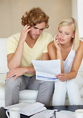 Image showing Couple, stress for bills and thinking of documents on sofa for debt, financial planning or budget risk and worry at home. Confused woman and man with headache for loan, bankruptcy or mortgage letter