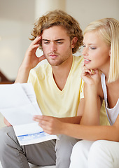 Image showing Finance, paper and couple with documents in a house for future planning, investment or asset management. Paperwork, insurance and people in a living room for bills, mortgage or home loan application