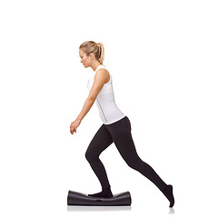 Image showing Woman, balance and mat in studio for fitness, pilates or workout for healthy body, wellness or exercise. Person, socks or yoga in sportswear for physical activity on mock up space or white background