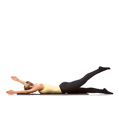 Image showing Woman, yoga and mat in studio for stretching, fitness or workout for healthy body, wellness or core muscle. Person, exercise or pilates on floor for abdomen health on mockup space or white background