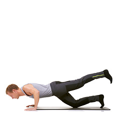 Image showing Man, pilates and mat in studio for stretching legs, fitness or workout for healthy body, wellness or core muscle. Person, exercise and yoga on floor for abdomen on mockup space or white background