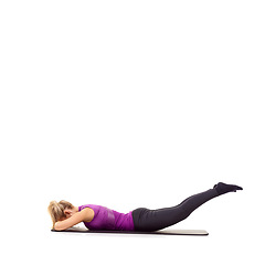 Image showing Woman, legs and glutes on yoga mat in studio for pilates performance, mockup space or white background. Female person, stretching and wellness progress exercise for training, challenge or healthy