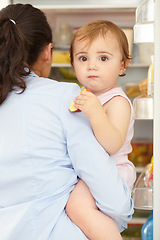 Image showing Portrait, woman and fruit of toddler in kitchen, open fridge and food for hunger in back view. Youth, little girl and hold snack for eating for nutrition in healthy vegan, vegetarian or diet in home