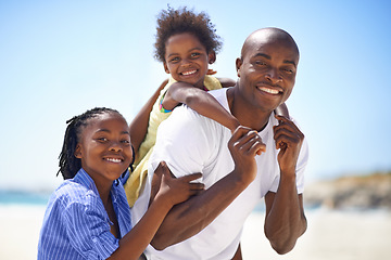 Image showing Portrait, piggyback and a family on the beach in summer together for travel, freedom or vacation. Love, smile or happy with a black man, son and and daughter on the coast for holiday or getaway