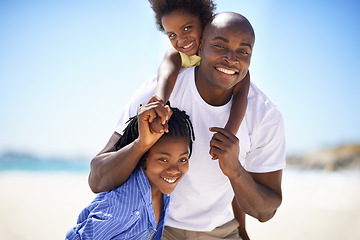 Image showing Portrait, piggyback and a black family on the beach in summer together for travel, freedom or vacation. Love, smile or happy with a father, son and daughter on the coast for holiday or getaway