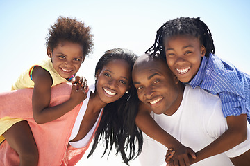 Image showing Black family, parents or children on piggyback at beach for adventure, holiday or vacation in summer. African people, face or smile outdoor in nature for break, experience or bonding and relationship