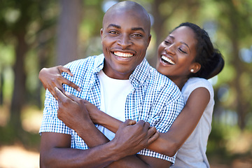 Image showing Hug, portrait or happy black couple in forest to relax or bond on holiday vacation together in nature. Hiking, travel or African woman with smile or man in woods trekking on outdoor park adventure