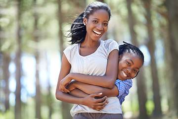 Image showing Portrait, mother and son hiking in the forest together as a black family for travel, freedom or adventure. Love, smile or hug with a happy young woman and excited boy child in the woods for bonding