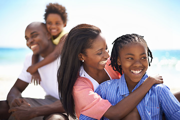 Image showing Smile, love and black family at the beach together for tropical vacation, adventure or holiday. Happy, travel and young African parents with girl children by the ocean for bonding weekend trip.