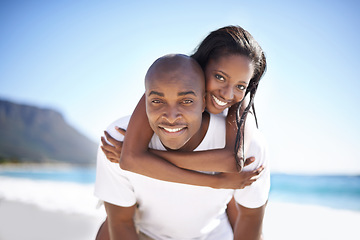 Image showing Happy, piggyback and portrait of black couple at beach for valentines day vacation, holiday or adventure. Smile, love and young African man and woman on a date by the ocean on weekend trip together.