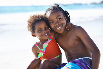 Image showing Portrait, black kids and happiness on beach with costume for adventure, holiday or vacation in summer. African sibling, face and smile outdoor in nature for break, experience or bonding with embrace