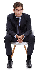 Image showing Businessman, sitting and portrait of manager in a chair with white background or mock up space in studio. Serious, entrepreneur and waiting on seat with professional style, fashion or suit for work