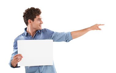 Image showing Pointing, poster and young man in a studio with mockup space for marketing, promotion or advertising. Smile, happy and handsome male person from Canada with empty banner isolated by white background.