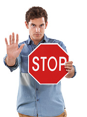 Image showing Portrait, man and traffic stop sign, palm and studio isolated on a white background. Person show red octagon symbol, hand and danger warning, forbidden caution and serious, security or prohibition