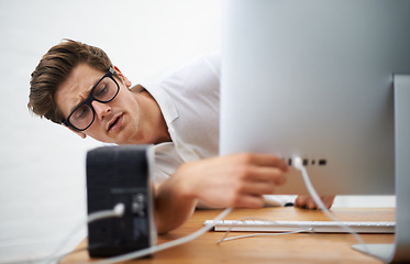 Image showing Computer, man and engineer on cable connection, hardware and repair digital desktop. Pc, technician and plug wire on port of electronics, serious nerd fixing system or problem solving for info tech