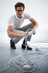 Image showing Portrait, electrician or man on cable connection, power and electricity in office. IT, technician and person plug wire, funny engineer and technology professional, geek and excited nerd in glasses