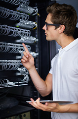 Image showing Server room, information technology and man with tablet, check connectivity and night job. Cybersecurity system, it network or person for fiber internet, data center or storage with cable connection