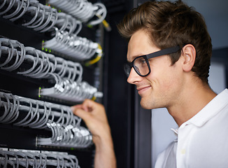 Image showing Server room, information technology and man with cables for connectivity, night and check hardware. Cybersecurity system, it network or person for internet, data center or storage solution with ideas