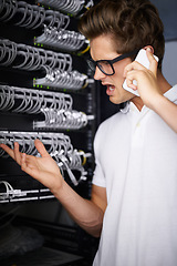 Image showing Server room, man and phone call for cable, connection or glitch in network, cybersecurity or confused in night at job. Technician, angry person or smartphone for talk, questions or report system fail