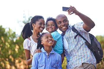 Image showing Happy black family, selfie and photo in nature for hiking, bonding or outdoor photography together. African mother, children and father smile taking picture or photograph for adventure in forest