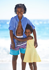 Image showing Children, siblings and portrait and beach for holiday vacation, outdoor relax or family bonding. Black people, girl and boy or face at ocean sand for happy kids adventure, summer fun or water explore