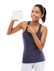 Image showing Woman, card and portrait of pointing to blank advertising, poster or mock up space in white background of studio. Indian, model and hand gesture to sign, post and paper for promotion or information