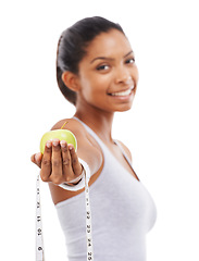 Image showing Apple, tape measure and lose weight with happy woman in white background or studio. Indian, model and portrait with healthy food for results in fitness, wellness and diet with nutrition and fruit