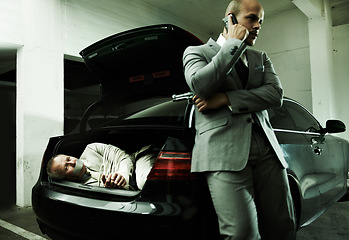 Image showing Phone call, car and man with hostage in trunk for negotiation, kidnapping danger and crime. Mafia, gangster criminal and business person in boot for financial crisis, debt and payment in parking lot