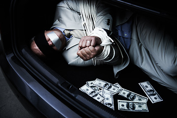 Image showing Man, tied up and kidnap in car with money, ransom and crime for wealth, debt or financial negotiation. Person with blindfold, rope and cash in trunk for abduction, danger and risk or scared for life