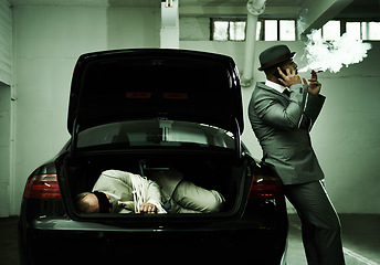 Image showing Phone call, smoking and criminal with hostage in trunk for negotiation, kidnapping ransom and crime. Mafia, gangster and business person in boot for abduction, robbery and money in parking lot