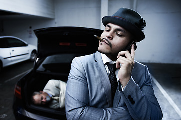 Image showing Phone call, car and criminal with hostage in trunk for negotiation, kidnapping danger and crime. Mafia, gangster and business man smoking in boot for abduction, crisis and ransom in parking lot