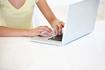 Image showing Woman, remote work and hands with laptop at table to update blog post, social media and digital download. Closeup of freelancer typing on computer for internet research, editing email or mockup space