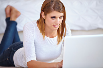 Image showing Woman, remote work and relax on floor with laptop to update blog post, social media and digital news subscription at home. Freelancer typing on computer for online shopping, editing email or research