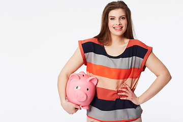 Image showing Portrait, finance and woman with piggy bank in studio for savings, payment our budget on white background. Money, box or face of person with cash container for investment or future financial freedom