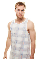 Image showing Man, portrait and confidence or fashion in studio with casual style, trendy outfit and calm expression. Person, face or relaxing, vest and satisfaction with peace, muscle or pride on white background