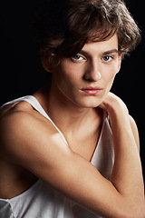 Image showing Portrait, serious and young man in studio isolated on a dark background in Australia. Face, confidence and casual male model or person in a vest for fashion, style or trendy clothes on a backdrop