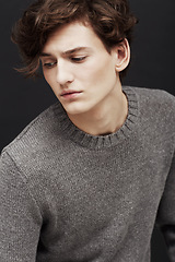 Image showing Thinking, serious and man in sweater for fashion in studio isolated on a a black background. Model in jersey with idea, .style and trendy clothes of young, handsome or casual person on a backdrop