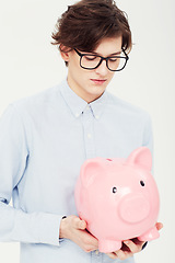 Image showing Piggy bank, thinking and man with finance, business and planning isolated on a white studio background. Person, model and entrepreneur with savings, transactions and investment with payment and ideas