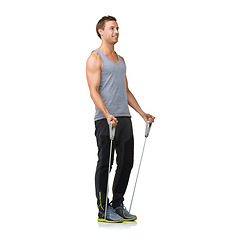 Image showing Fitness, man and resistance band to exercise in studio, health and weight training for strong muscles. Sports person, workout and commitment by gym equipment in mockup and happy on white background