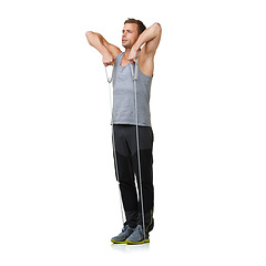 Image showing Workout, man and stretching a resistance band in studio, gym and fitness training for strong muscles. Sports person, exercise and commitment by gym equipment in mockup and cardio by white background