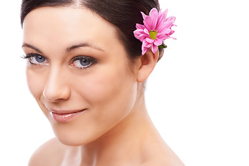 Image showing Portrait, flower and happy woman in studio for skincare, wellness or natural cosmetics on white background. Daisy, beauty or model face with floral cosmetology, shine or skin glow with spa aesthetic