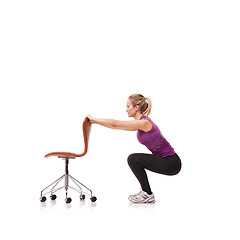 Image showing Pilates, exercise and woman squat with chair or crouch in white background or studio. Stretching, body and person in workout with a seat for fitness, health and wellness practice for posture