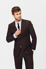 Image showing Fashion, style and a young business man in studio isolated on a white background for his corporate career. Work, job and a confident person in a trendy suit for formal employment or occupation